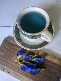 High angle view of purple and blue flowers on table