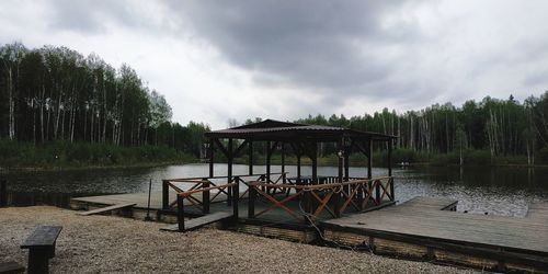 Pier over lake against sky