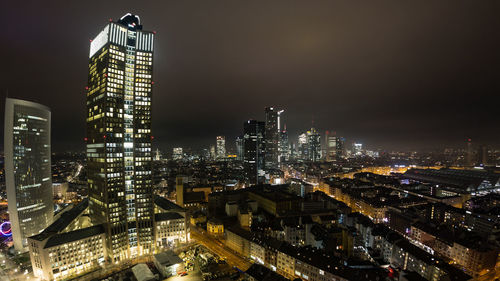 High angle view of illuminated buildings in city at night