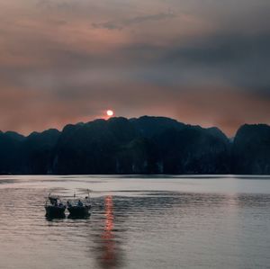 Scenic view of lake against sky during sunset