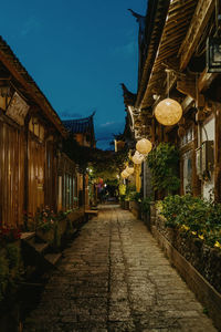 Street amidst buildings against sky