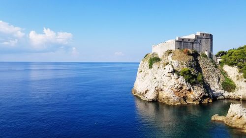 Scenic view of sea against blue sky