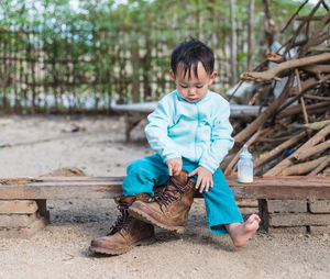 Full length of boy playing outdoors