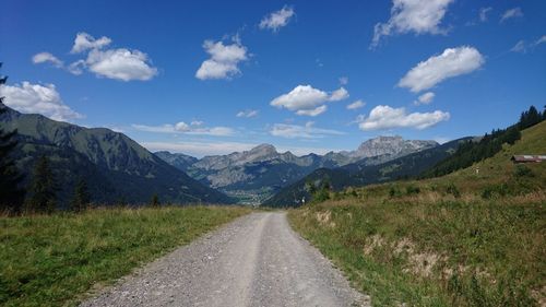 Road amidst landscape against sky