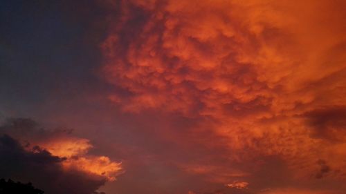 Low angle view of dramatic sky during sunset