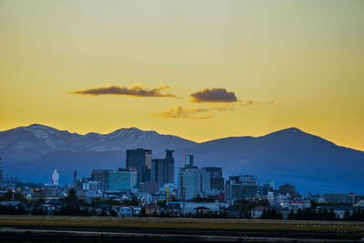 Cityscape against sky during sunset