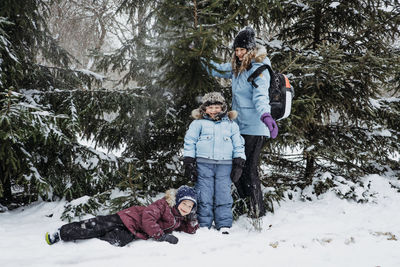 Outdoors winter activities for family, friends. happy family, friends, two women, two boy kids and