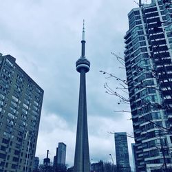 Low angle view of buildings in city against sky