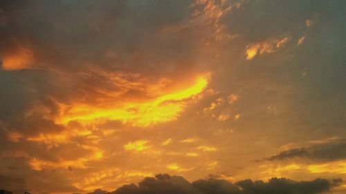 Low angle view of cloudy sky at sunset