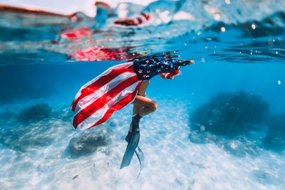 High angle view of man swimming in sea