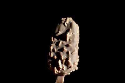 Close-up of ice cream against black background