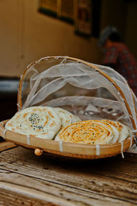 Close-up of bread in basket on table