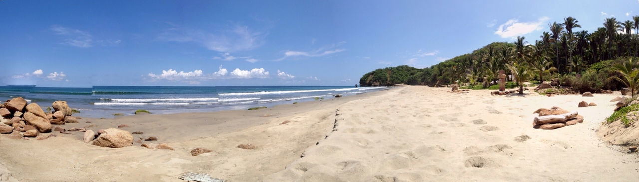 beach, sea, sand, shore, horizon over water, sky, water, tranquil scene, tranquility, scenics, beauty in nature, nature, coastline, incidental people, vacations, blue, cloud, idyllic, cloud - sky, day