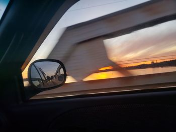 Reflection of sky on car window