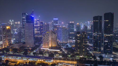 Illuminated buildings in city at night