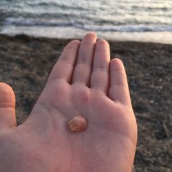 Close-up of person holding hand