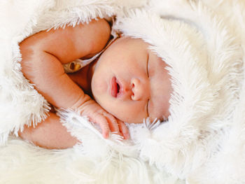 New born baby sleep tight with white blanket