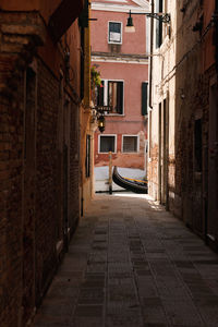 Narrow alley amidst buildings in city