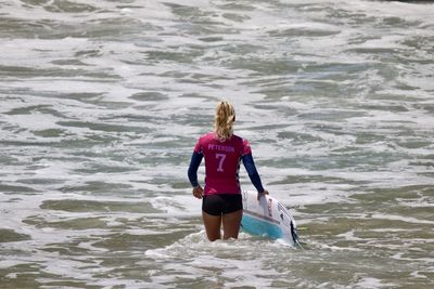 Woman standing in sea