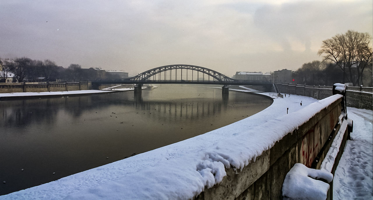 bridge - man made structure, winter, weather, connection, built structure, architecture, cold temperature, water, snow, river, sky, transportation, nature, day, outdoors, no people, tree, building exterior