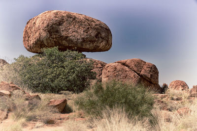 Low angle view of rock formation against sky