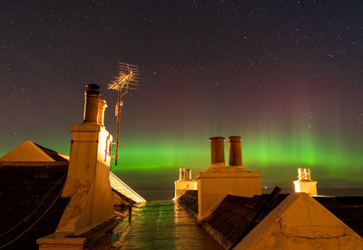 View behind our village against the starry night with aurora    northern lights in pennan