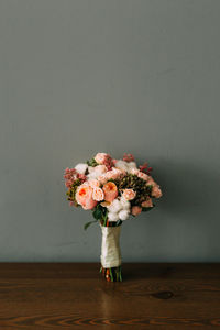 Flower bouquet against wall