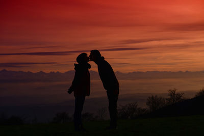 Silhouette of woman at sunset