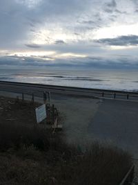 Scenic view of beach against sky during sunset