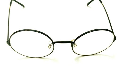 Close-up of eyeglasses against white background