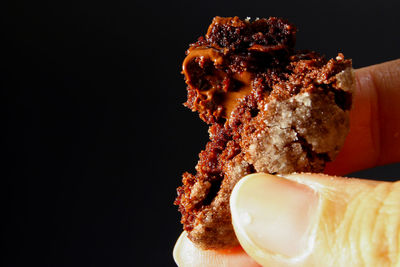 Close-up of ice cream cone against black background