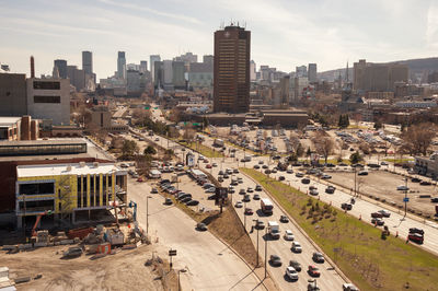 High angle view of buildings in city against sky