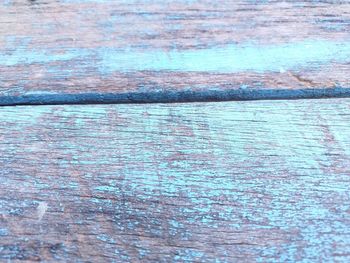 Full frame shot of wood with sea in background