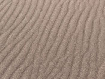 Full frame shot of sand at sandy beach