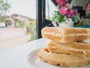 Close-up of bread in plate on table