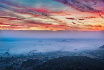 Scenic view of dramatic sky during sunset