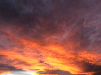 Low angle view of dramatic sky during sunset