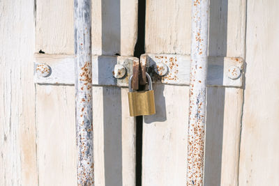 Old wooden door with padlock