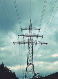 Low angle view of electricity pylon against sky