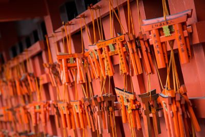 Close-up of clothes hanging in row