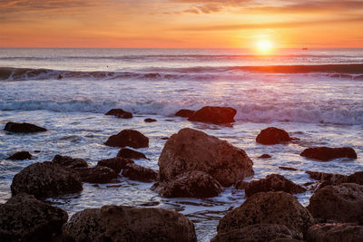 Atlantic ocean sunset at costa da caparica, portugal