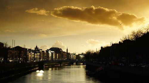 View of bridge over river against cloudy sky