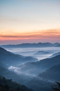 Scenic view of mountains against sky during sunset