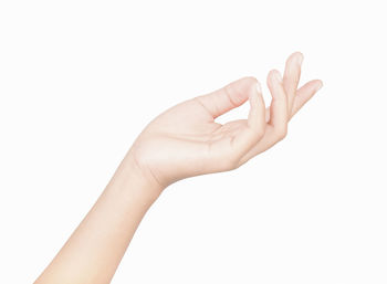 Close-up of human hand over white background