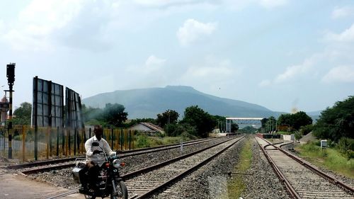 Man walking on railroad station platform