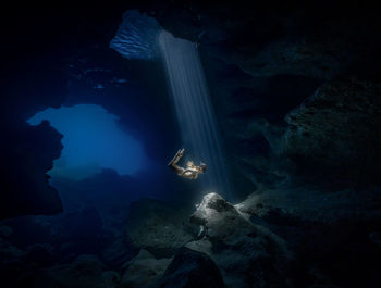 High angle view of woman swimming in sea