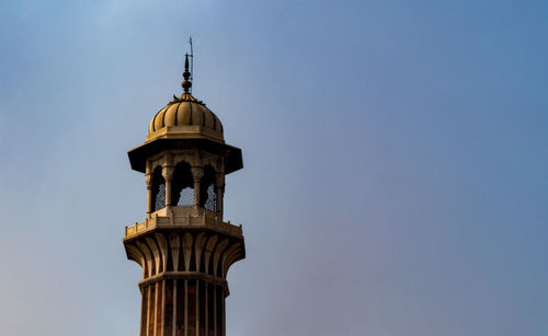 Low angle view of bell tower against sky