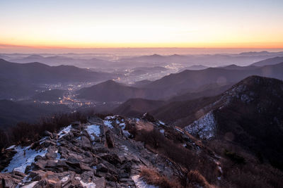 Scenic view of mountains against sky during sunset