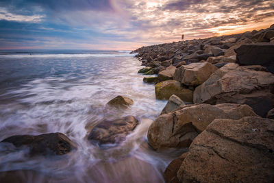 Scenic view of sea against sky during sunset