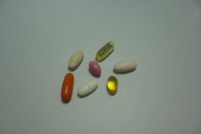 High angle view of multi colored pencils on white background